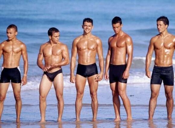 men at the beach with cocks spread out